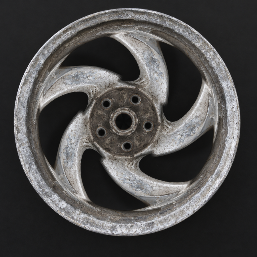 Oxidised and corroded moped wheel before treatment